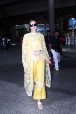 Kriti Sanon dressed in yellow churidar wearing black sunglasses